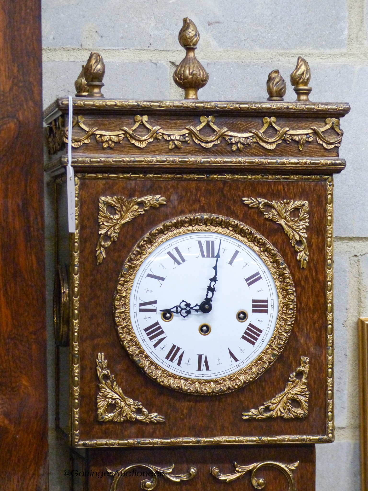 A reproduction gilt metal mounted longcase clock, height 184cm